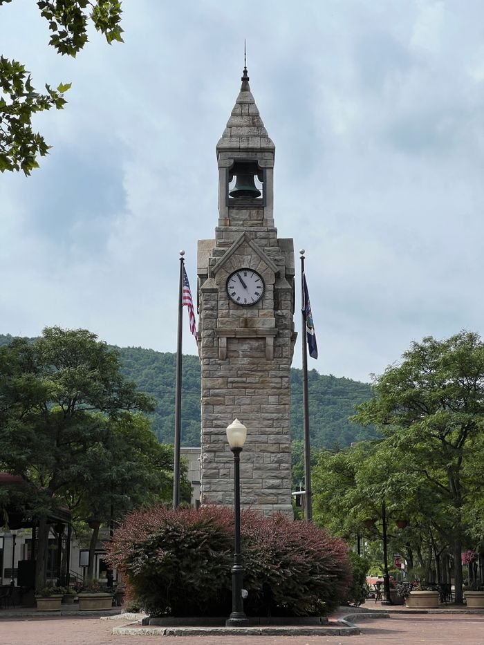 Iconic clock tower surrounded by trees in Wellsboro, Pennsylvania, USA.